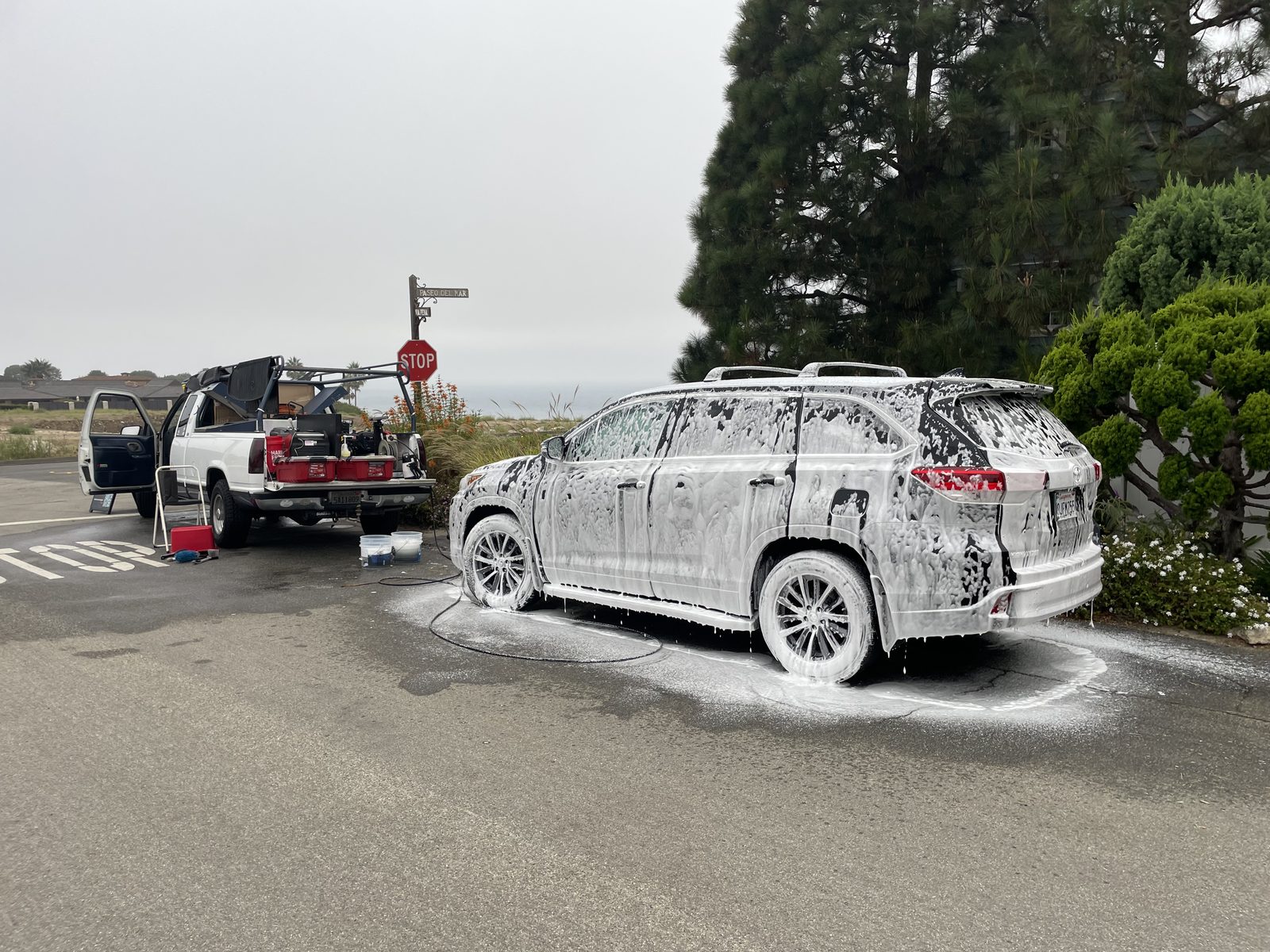 Mobile SUV foam wash beside the work truck